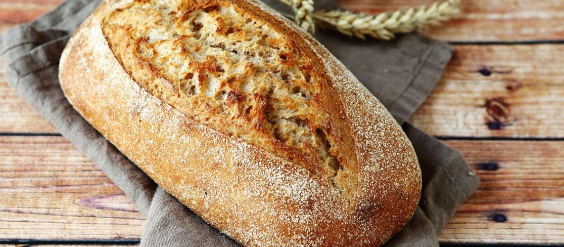 Loaf of bread on bread board