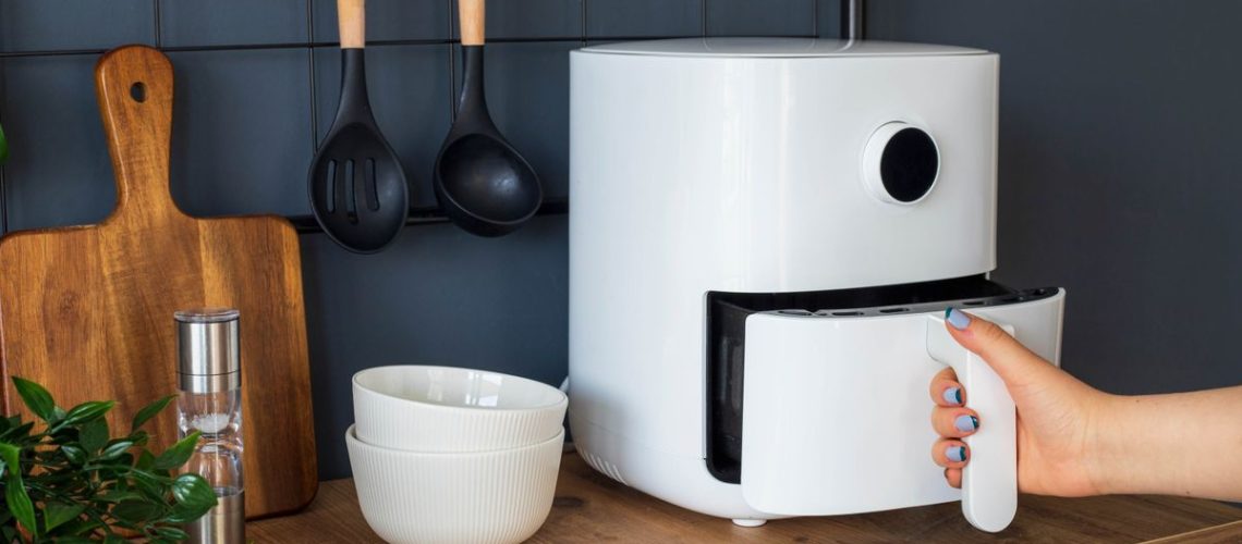 An air fryer on a kitchen counter