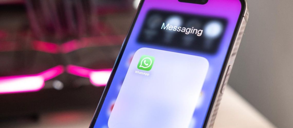 The WhatsApp app tile visible on an iPhone screen