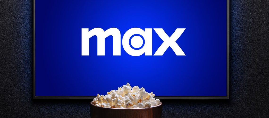 Max logo on TV with popcorn and remote control on table