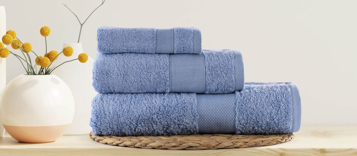 A stack of three blue towels