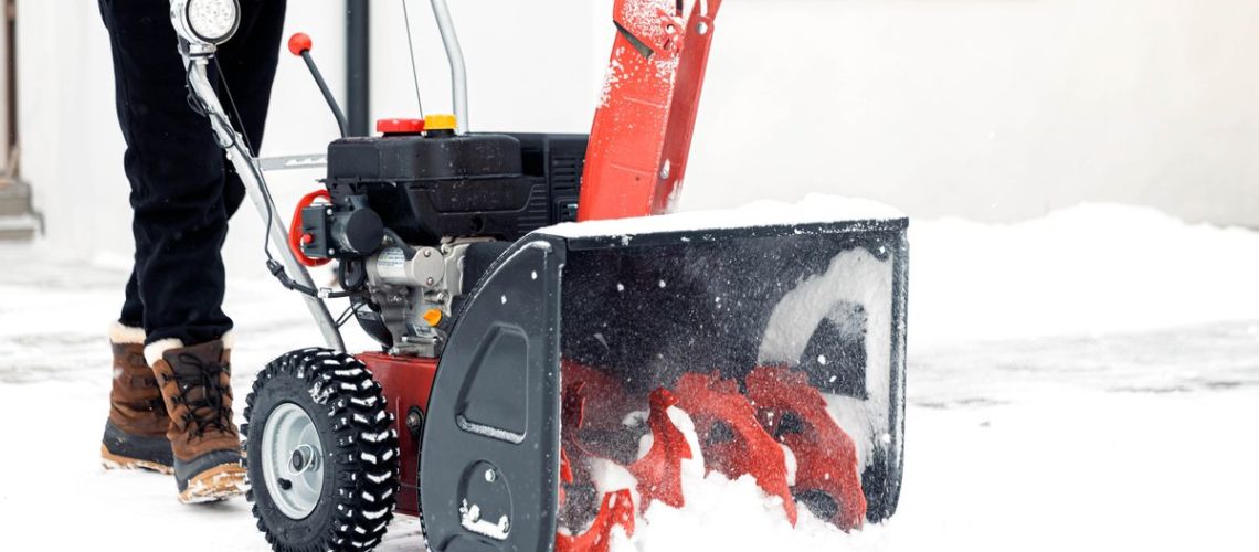 Person using a snow blower