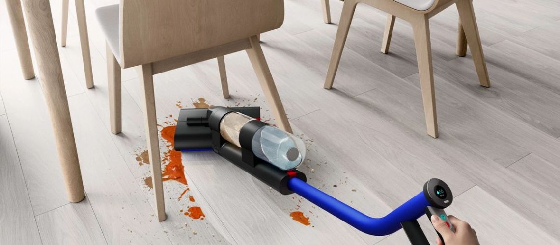 The Dyson WashG1 cleaning under a table