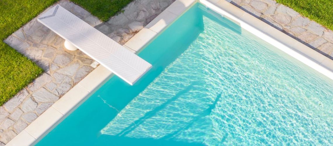 An overhead view of a clean blue swimming pool