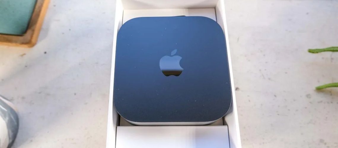 Apple TV 4K sitting on a benchy on a sunny day.