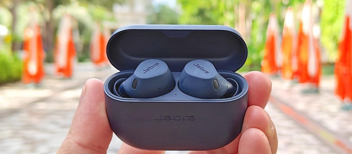 Jabra Elite 8 Active in black held in hand of reviewer