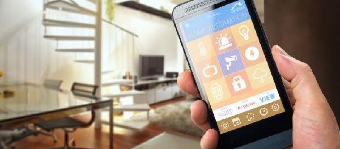 A hand holding a smartphone with a smart home menu pulled up