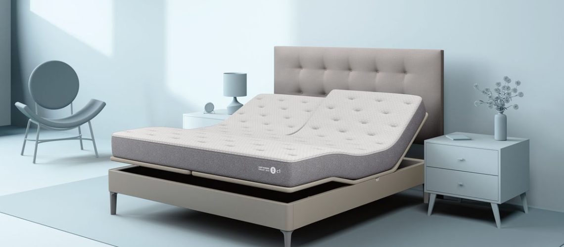 The Sleep Number c1 Smart bed on an adjustable bed base in a bedroom