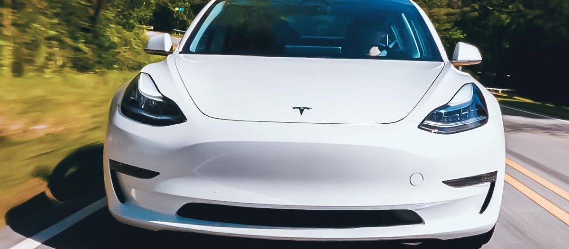 Tesla Model 3 in white on road