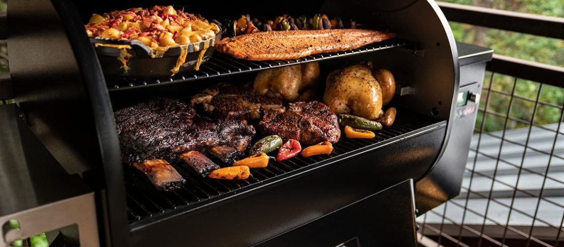 A selection of meats, veg & fish cooking in a Traeger grill