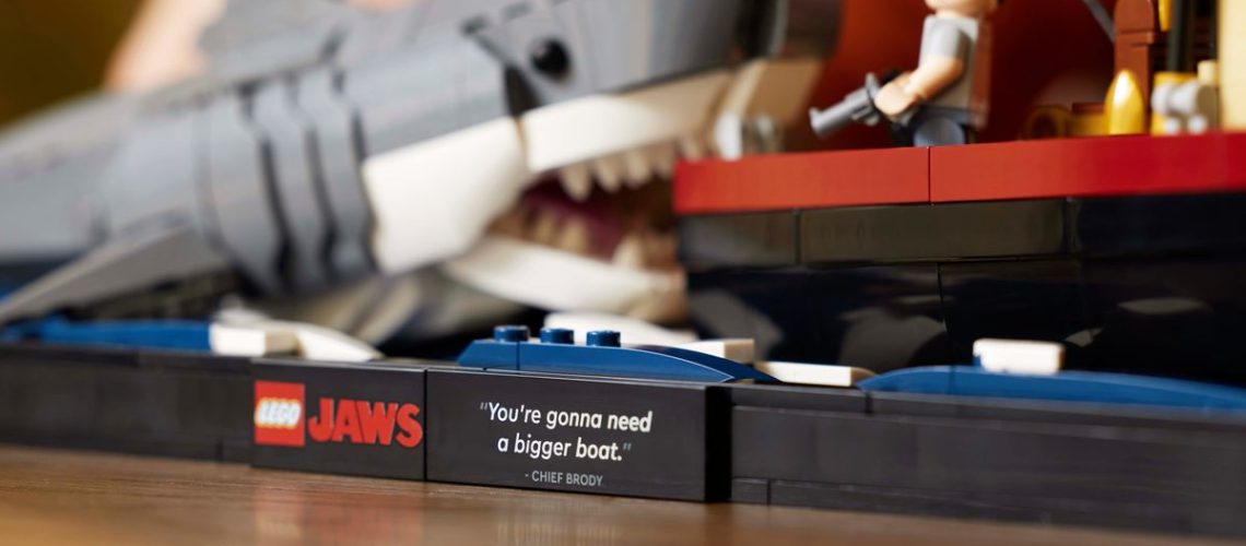 A close-up of the assembled LEGO Ideas Jaws set, showing the plaque bearing the