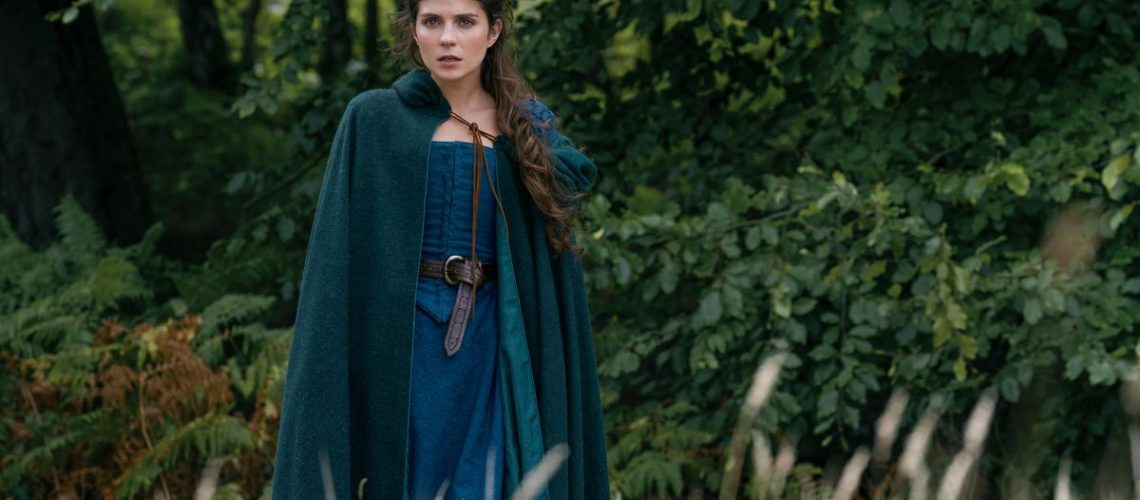 Lady Jane Grey (Emily Bader) in a blue robe and cloak in Prime Video