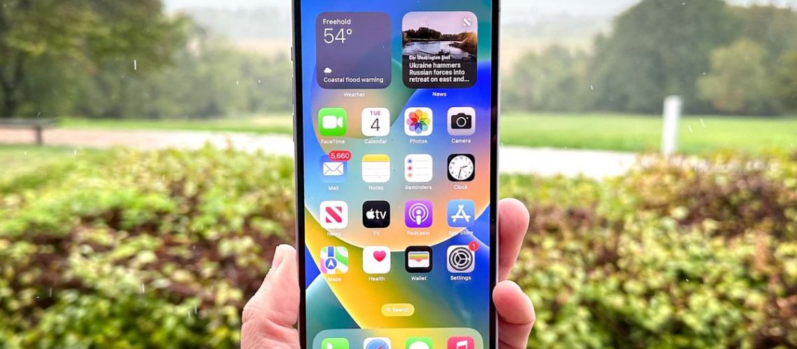 iPhone 14 Plus shown held in hand