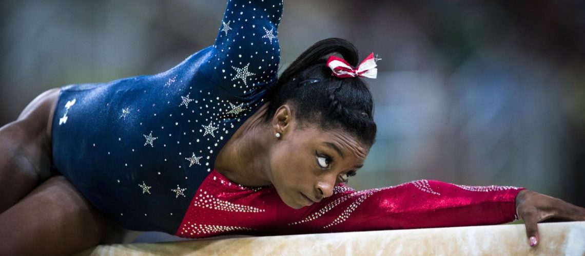 Simone Biles performing in her Team USA leotard