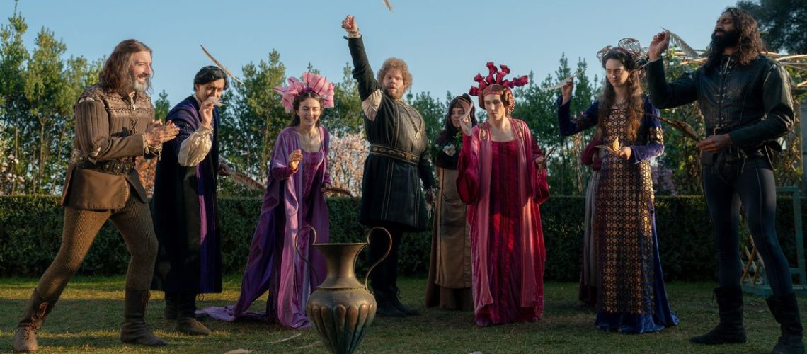 The cast of "The Decameron" gathered around a vase in the show