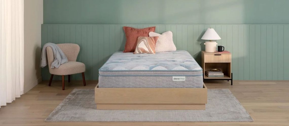 The Beauty Sleep 14.25 Ultra Plush Pillow Top mattress in a sunny bedroom
