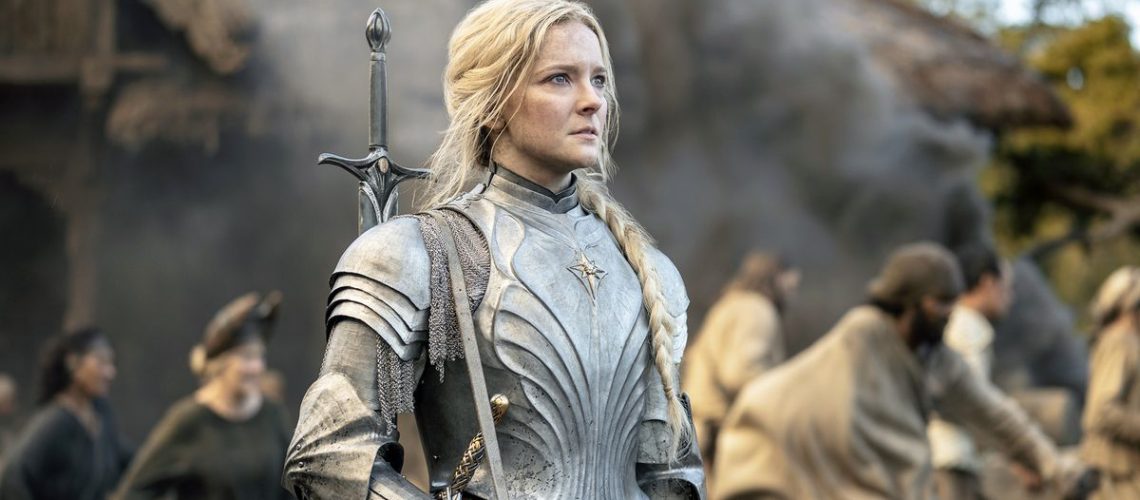 Morfydd Clark (Galadriel) looks concerned as people behind her are on the move in The Lord of the Rings: The Rings of Power episode 6