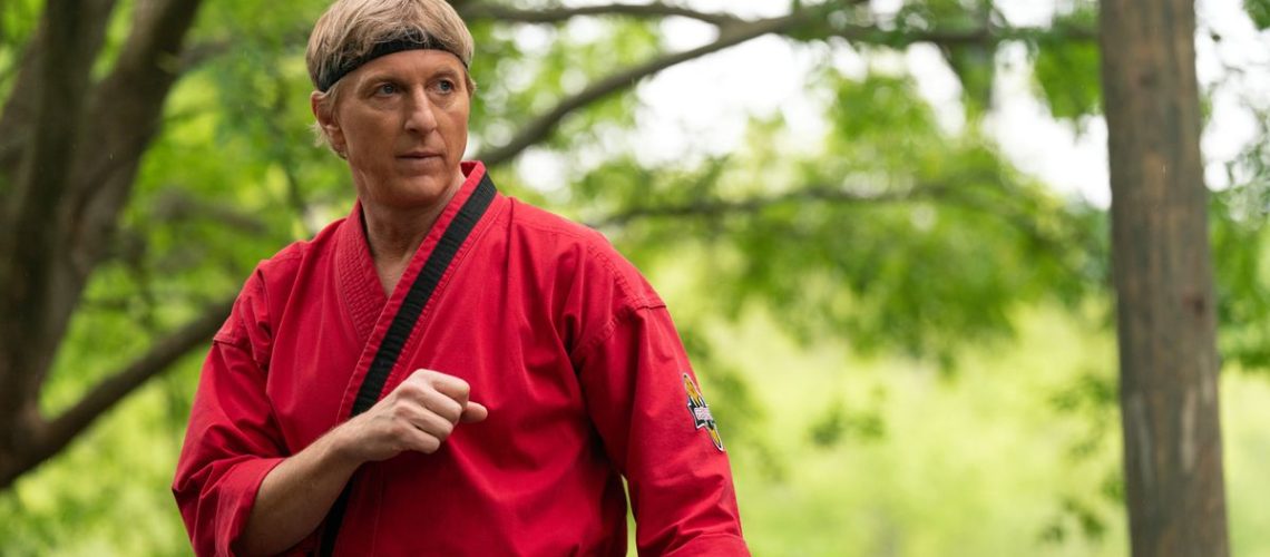 William Zabka in red kung fu attire in