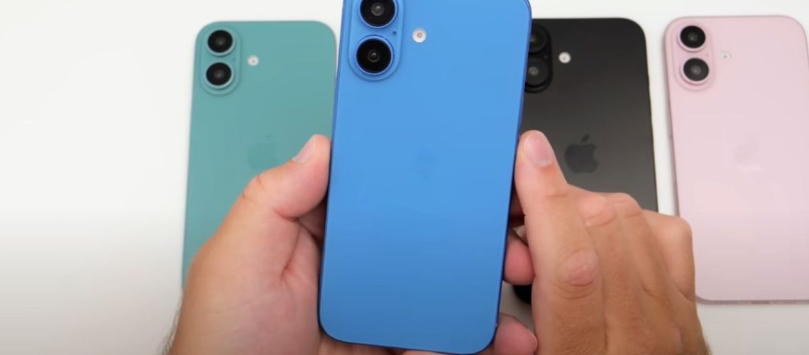 iPhone 16 in hand with multiple colors
