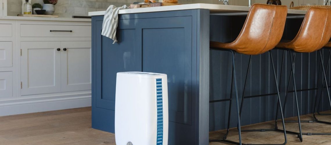 A Meaco dehumidifier in a blue kitchen