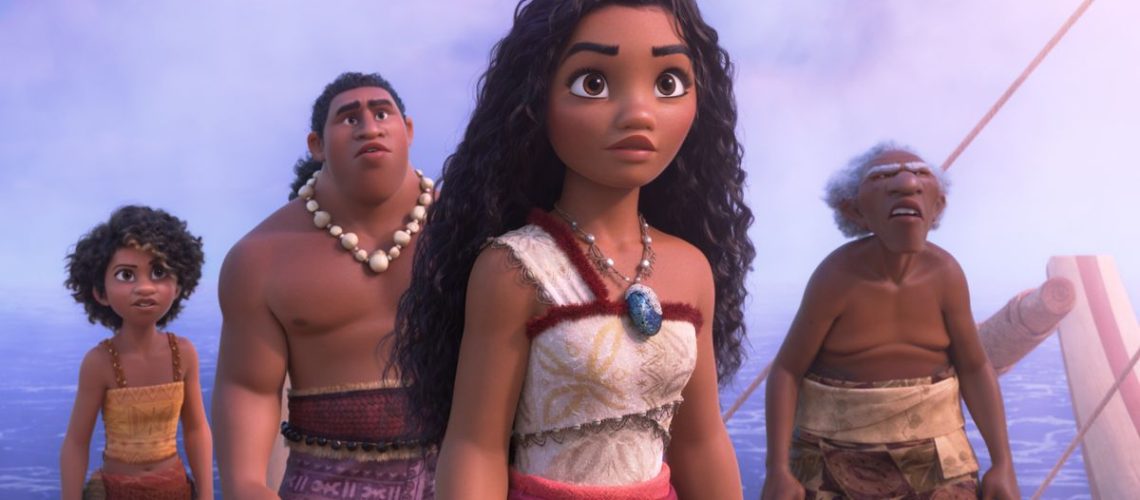 A screenshot from Moana 2, showing Moana (center) flanked by fellow people from Motonui