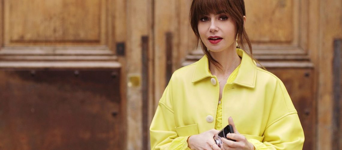 Emily (Lily Collins) wearing a yellow shirt in