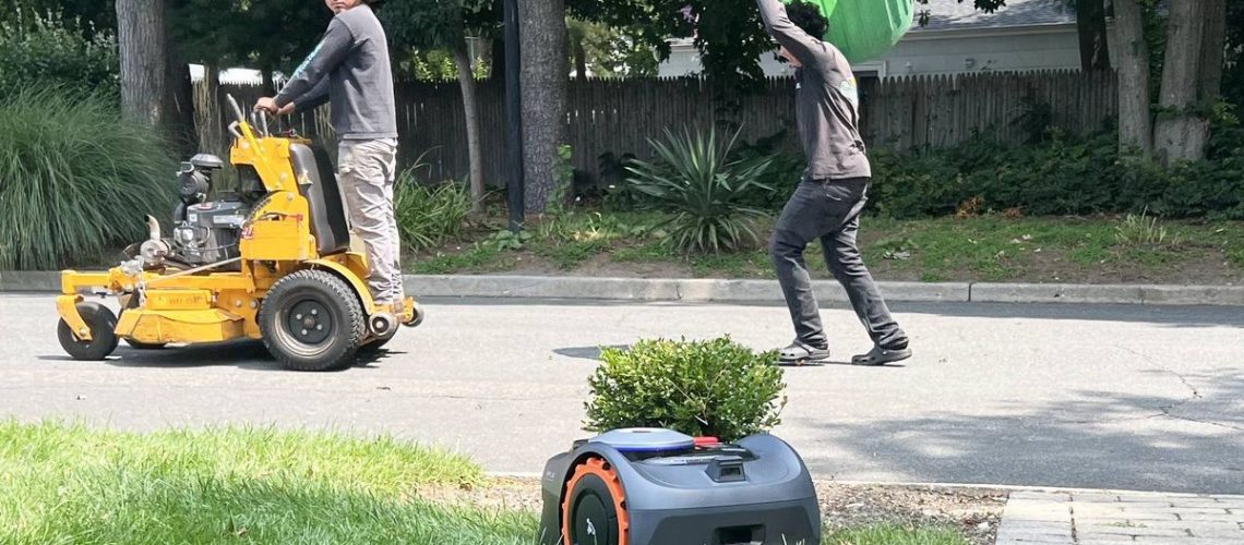 Landscapers pass by Navimow