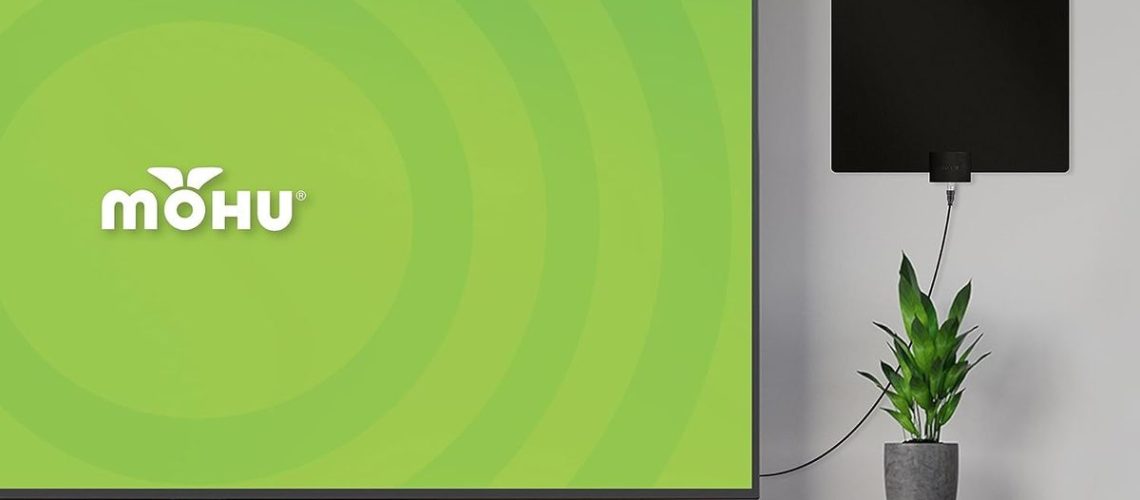 The Mohu Leaf in a living room near a TV.