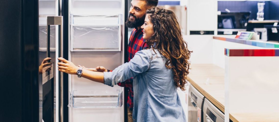 male and female couple shopping for a refrigerator