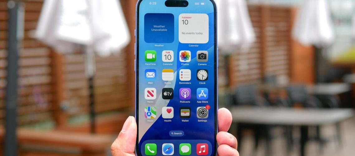 Apple iPhone 16 held in the hand.