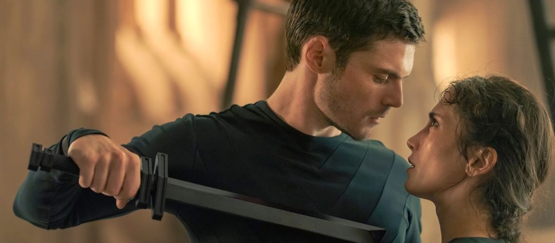 Keiran Atreides (Chris Mason) holds a knife up to Princess Ynez Corrino (Sarah-Sofie Boussnina) in Max's "Dune: Prophecy"