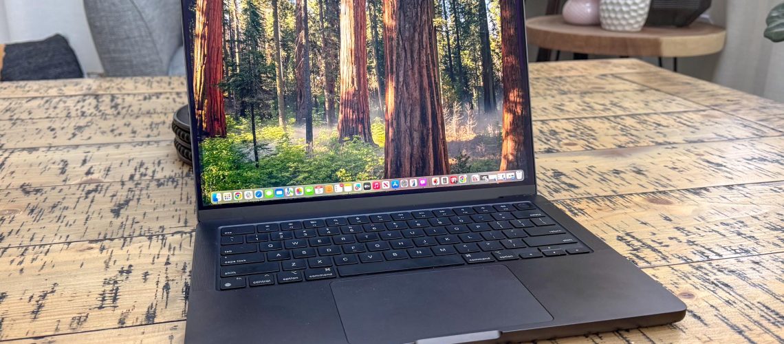 MacBook Pro 14-inch (2024, M4) shown open on a table