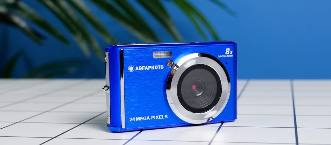 A blue AgfaPhoto Realishot DC5500 compact camera