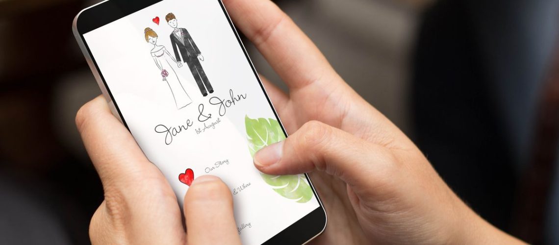 A person looking at a wedding invitation on their phone