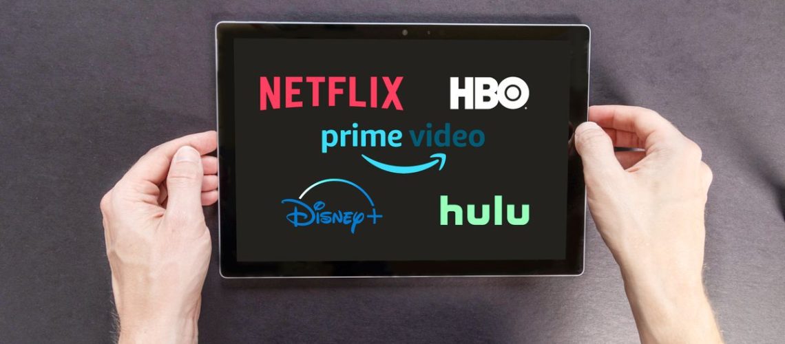 Netflix, HBO, Prime logos on tablet