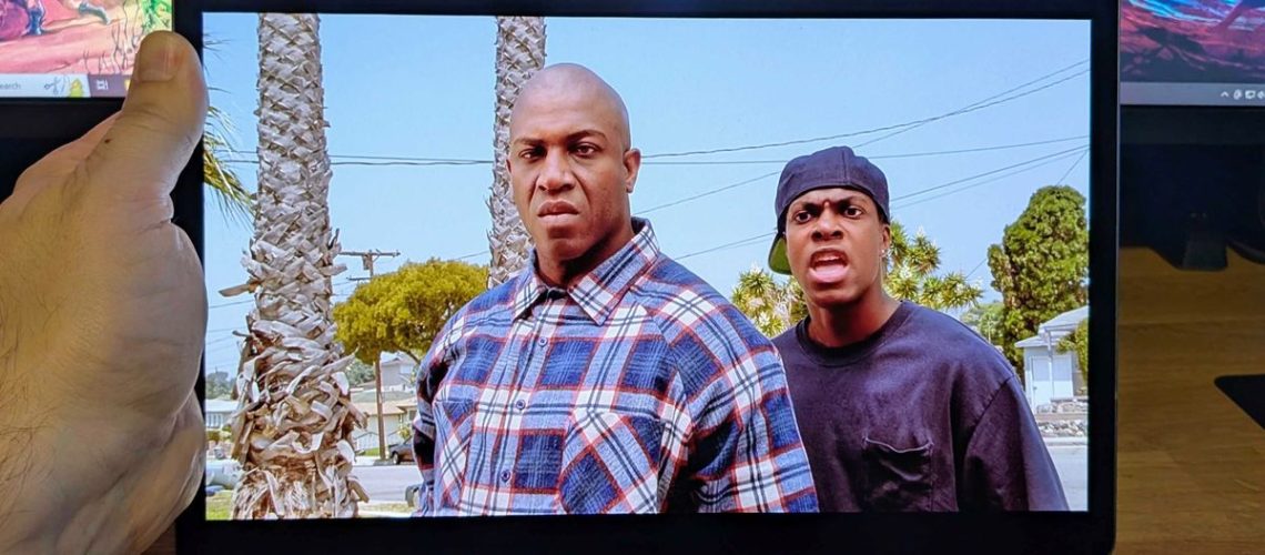 Samsung Galaxy Tab S10 Plus held up with movie Friday playing on display