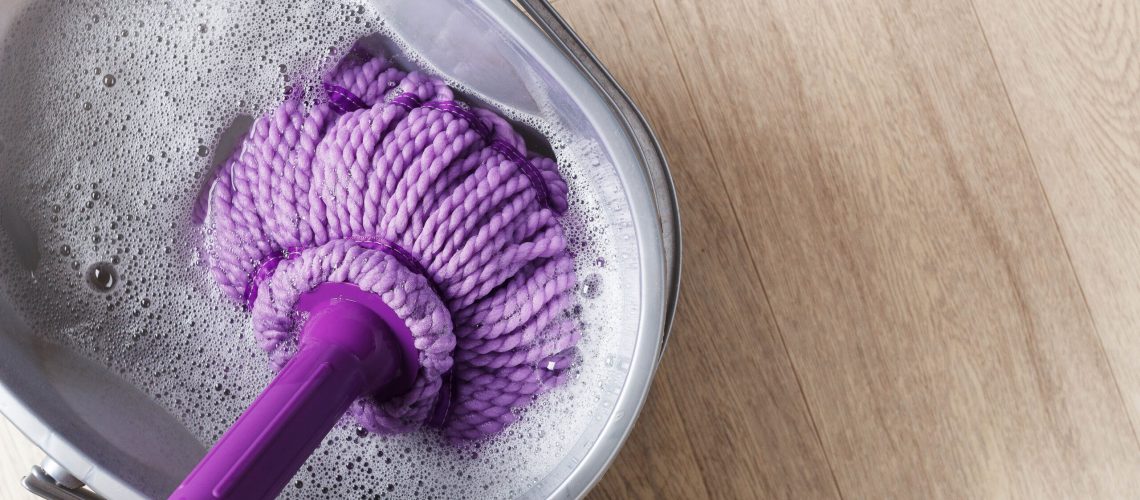 Purple mop in bucket of water