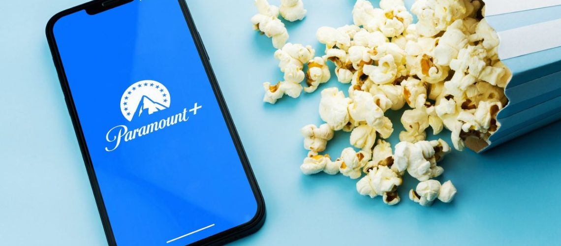 Paramount Plus app on a phone next to popcorn