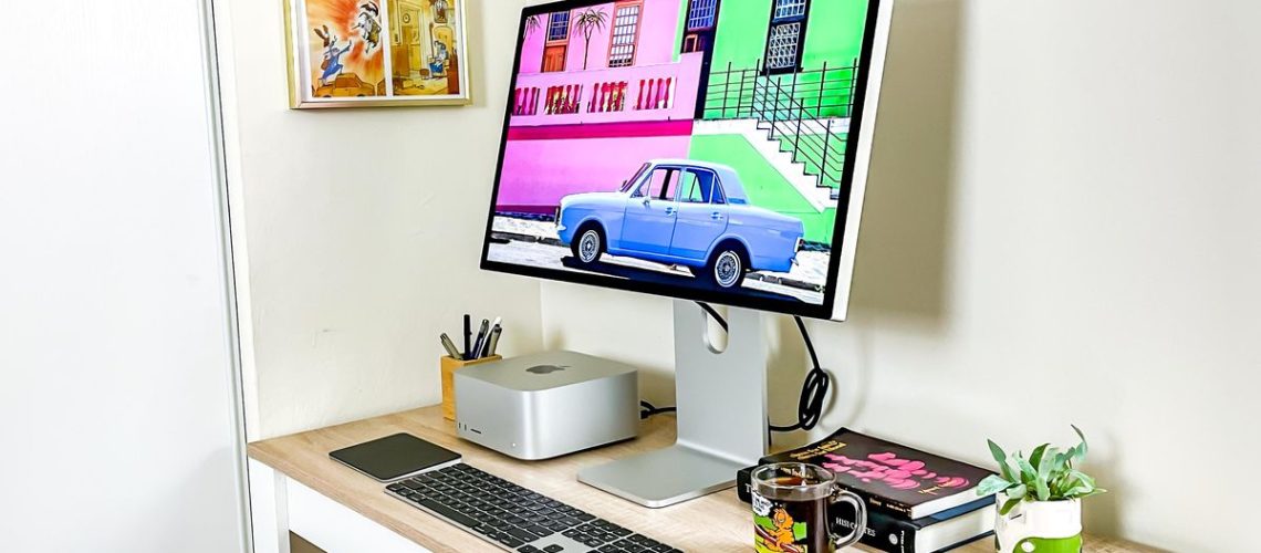 Mac Studio on desk plugged into Studio Display