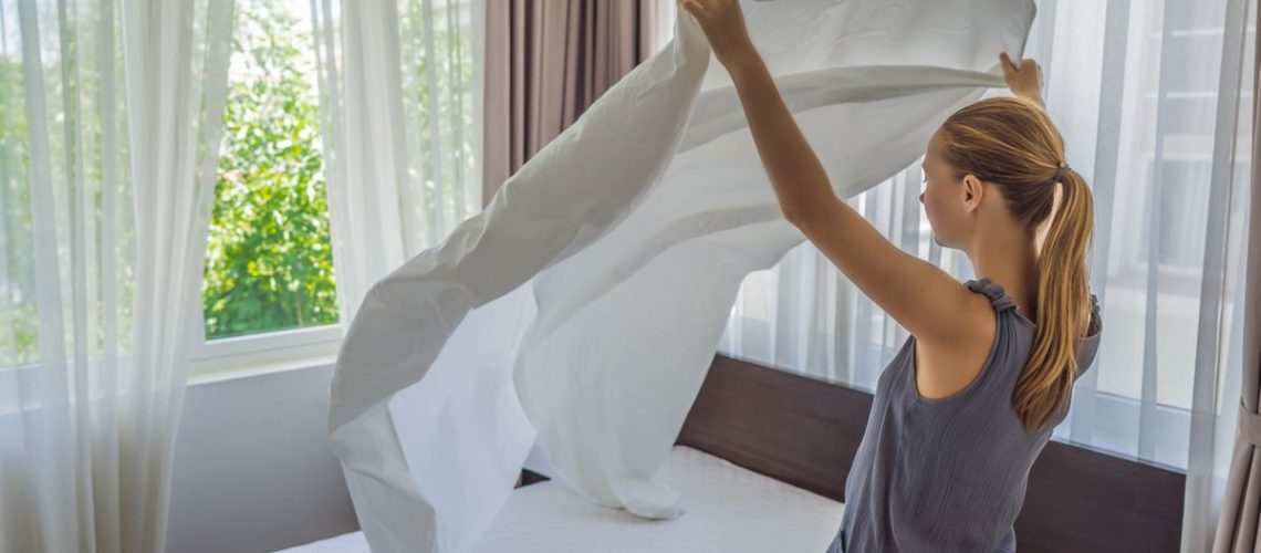 Woman changing bedding