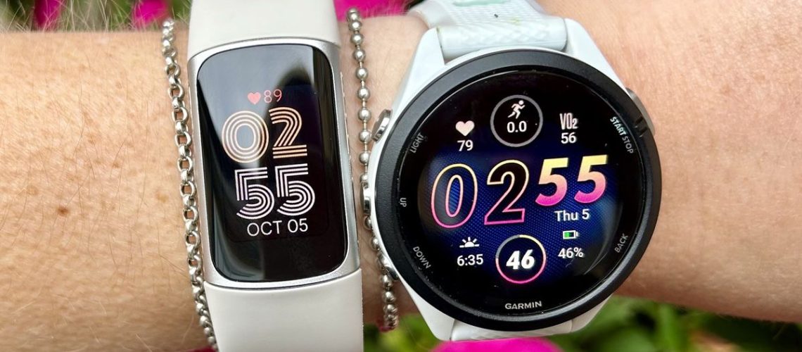 a photo of the Fitbit Charge 6 and Garmin Forerunner 265