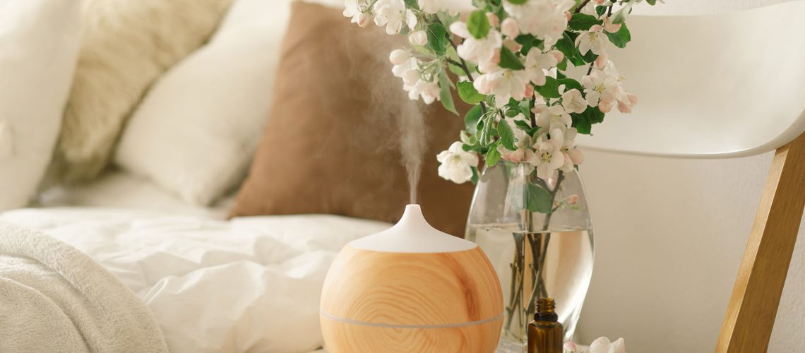 Diffuser on a bedside table within a calm bedroom setting