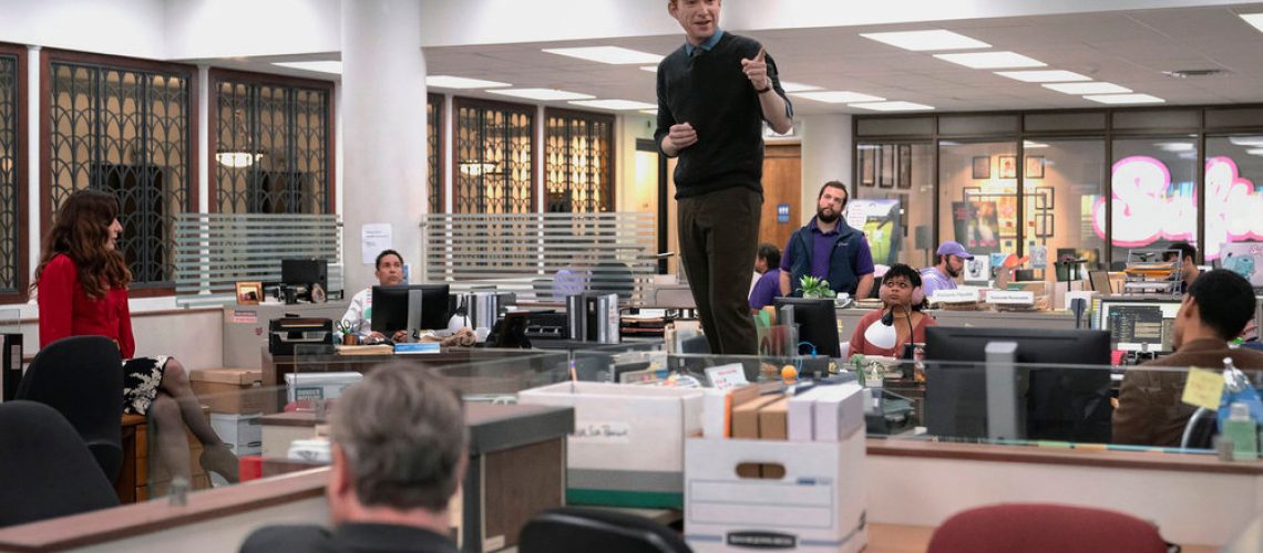 L-R: Esmerelda (Sabrina Impacciatore), Oscar (Oscar Nunez), Ned (Domhnall Gleeson), Adelola (Gbemisola Ikumelo) in an office building in a scene from "The Paper" pilot episode.