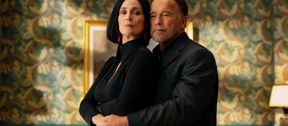 Carrie-Anne Moss as Greta Nelso and Arnold Schwarzenegger as Luke Brunner in