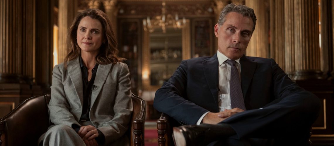 L-R: Kate Wyler (Keri Russell) and Hal Wyler (Rufus Sewell) sit side by side in a first look image for Netflix's "The Diplomat" season 3