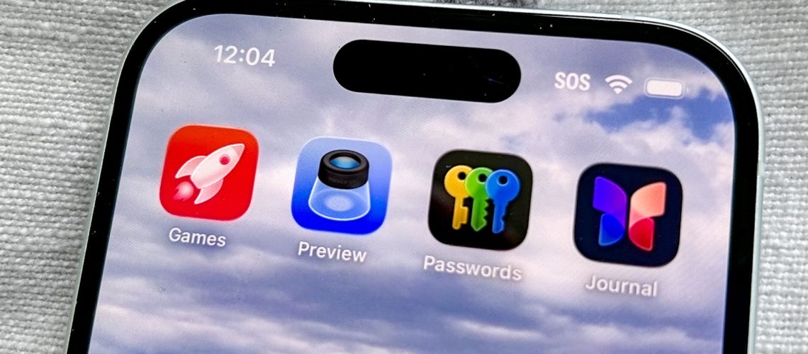 The Apple Games app in iOS 26 on an iPhone 15 screen