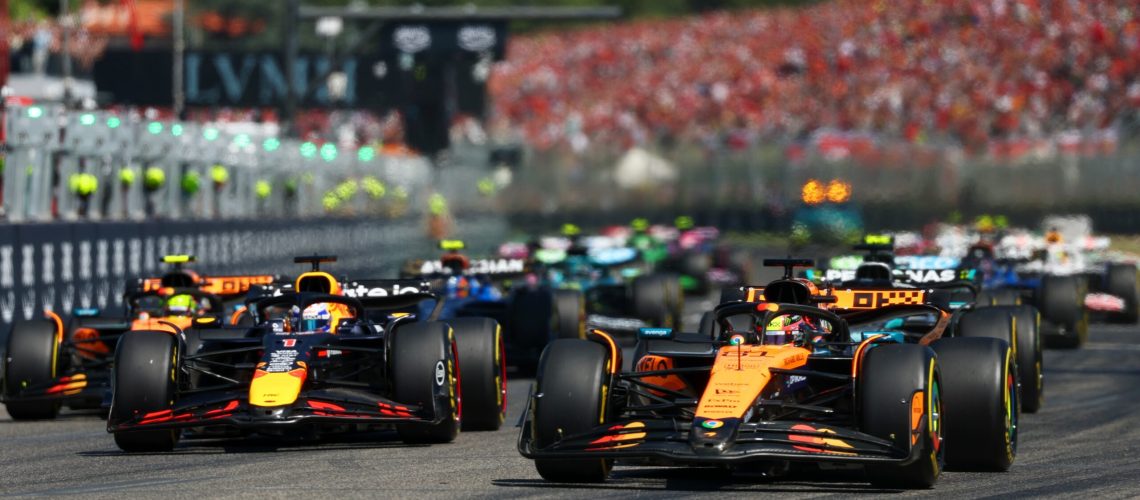 Oscar Piastri of Australia driving the (81) McLaren MCL39 Mercedes leads Max Verstappen of the Netherlands driving the (1) Oracle Red Bull Racing RB21 and the rest of the field at the start during the F1 Grand Prix of Emilia-Romagna