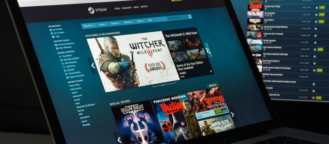 Steam storefront on laptop screen.