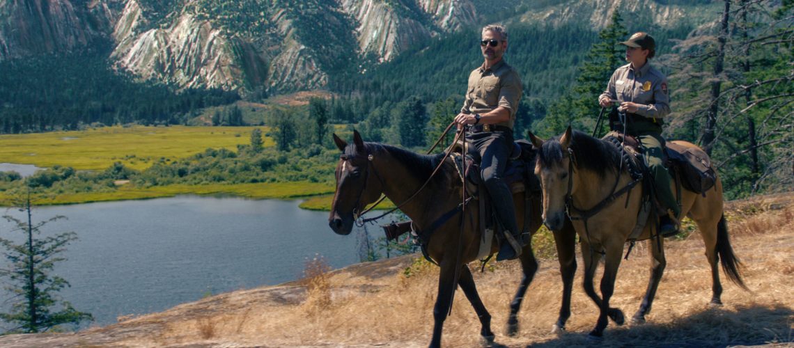 Kyle Turner (Eric Bana) and Naya Vasquez (Lily Santiago) on horseback riding through Yosemite landscape in Netflix's "Untamed"