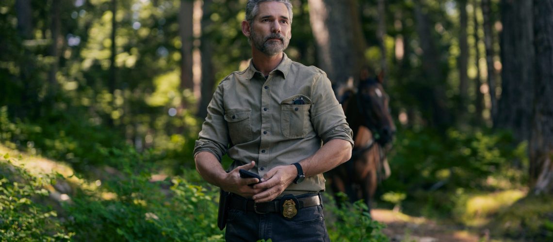 Kyle Turner (Eric Bana) stands in the forest in a scene from Netflix's "Untamed"